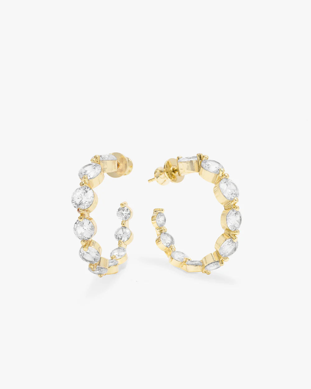 Gold hoop earrings with clear gemstones