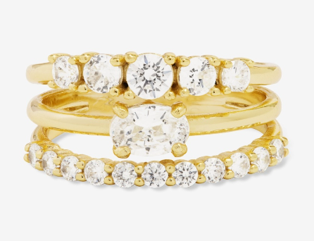 Set of gold rings with clear gemstones 