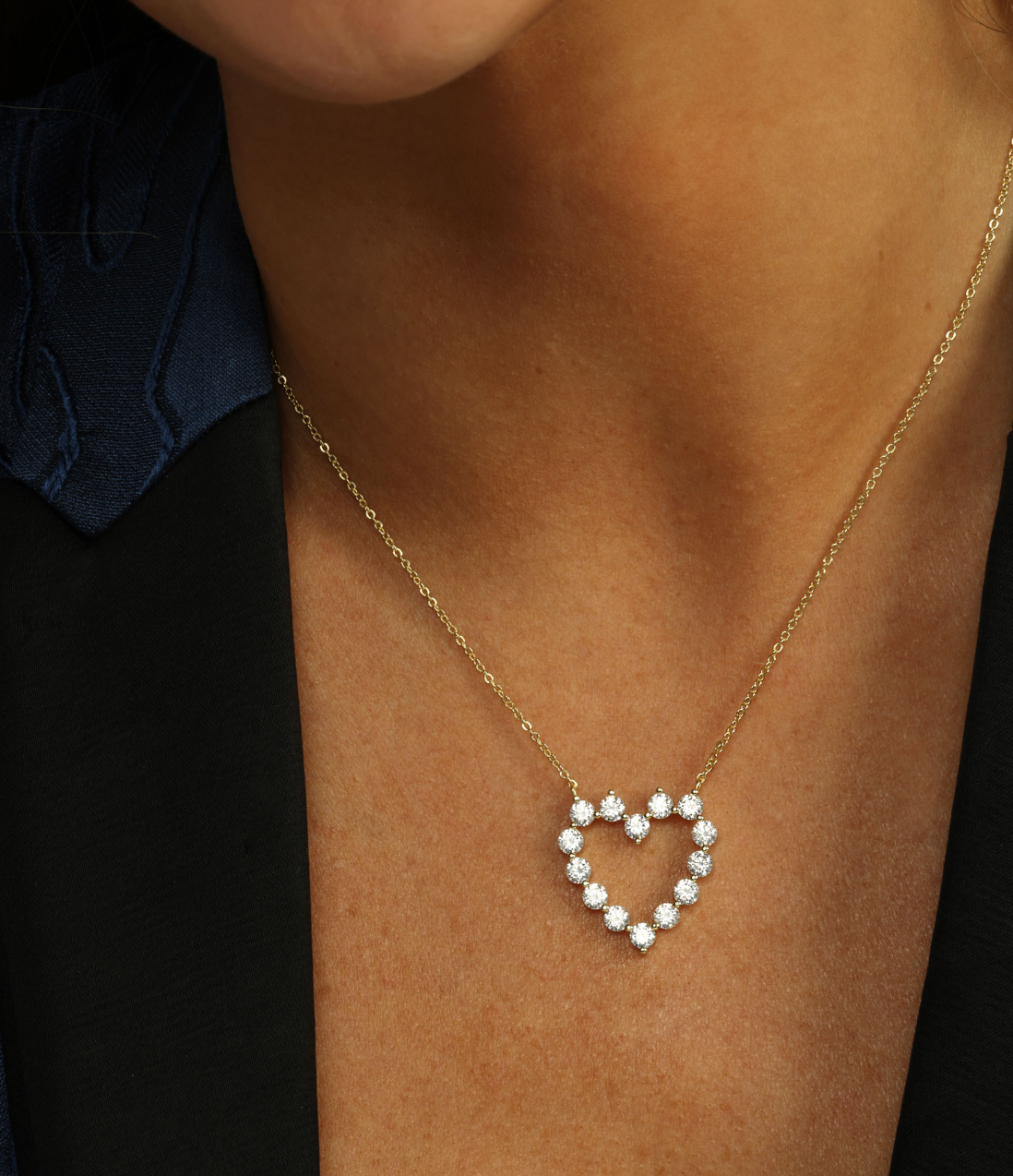Gold necklace with a heart-shaped pendant