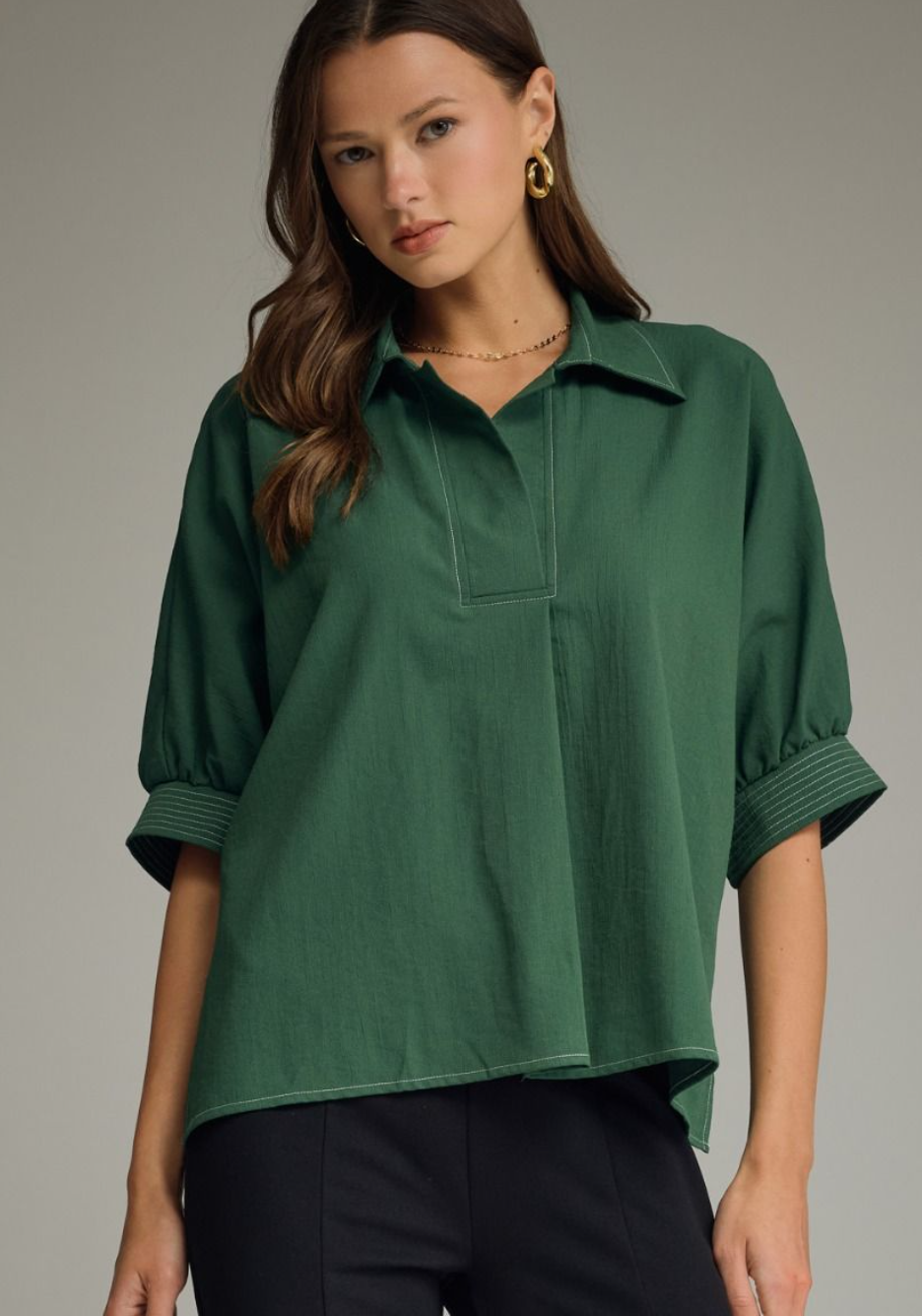 Solid short sleeve top featuring split V-neck collar